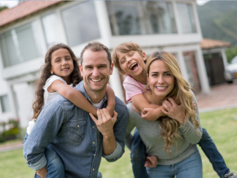 Family in front of a house